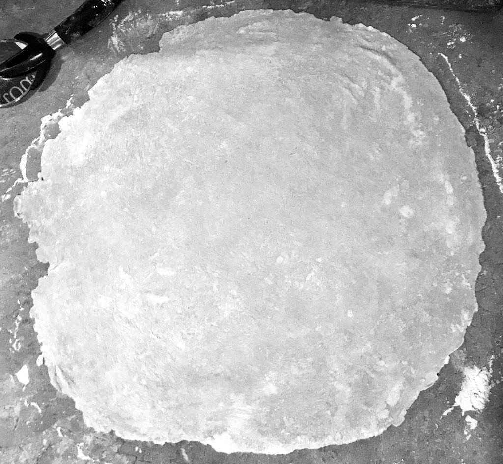 3. Use a rolling pin to roll out to a rough, 12 inch round